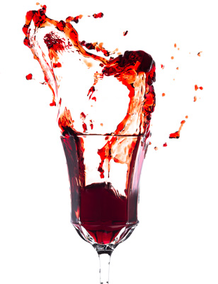 Glass of splash red wine
